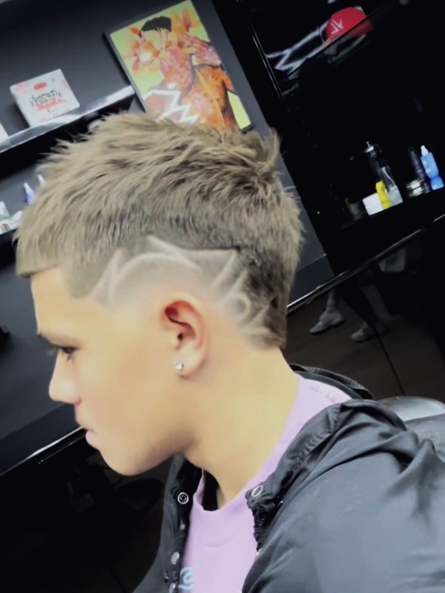 Skin fade finished with a shaved line detail